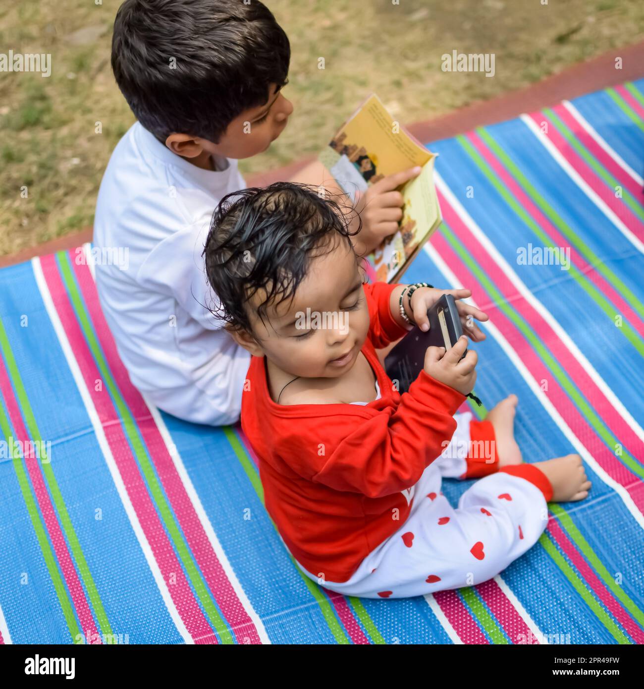 Two happy boys in society park, happy Asian brothers who are smiling