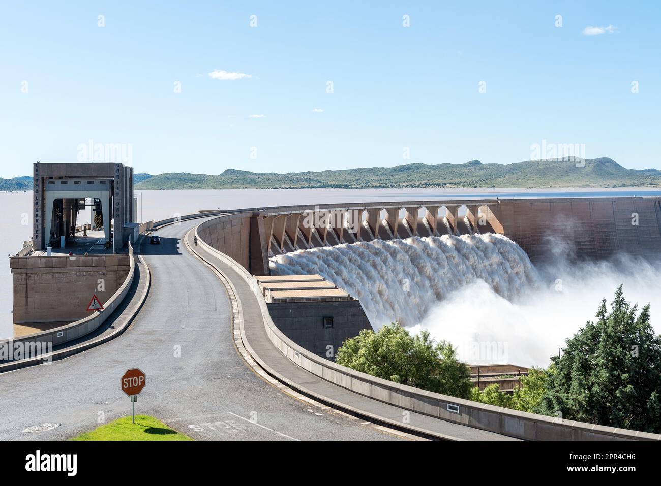 The largest dam in South Africa, the Gariep Dam, overflowing. It is in the Orange River. People are visible Stock Photo