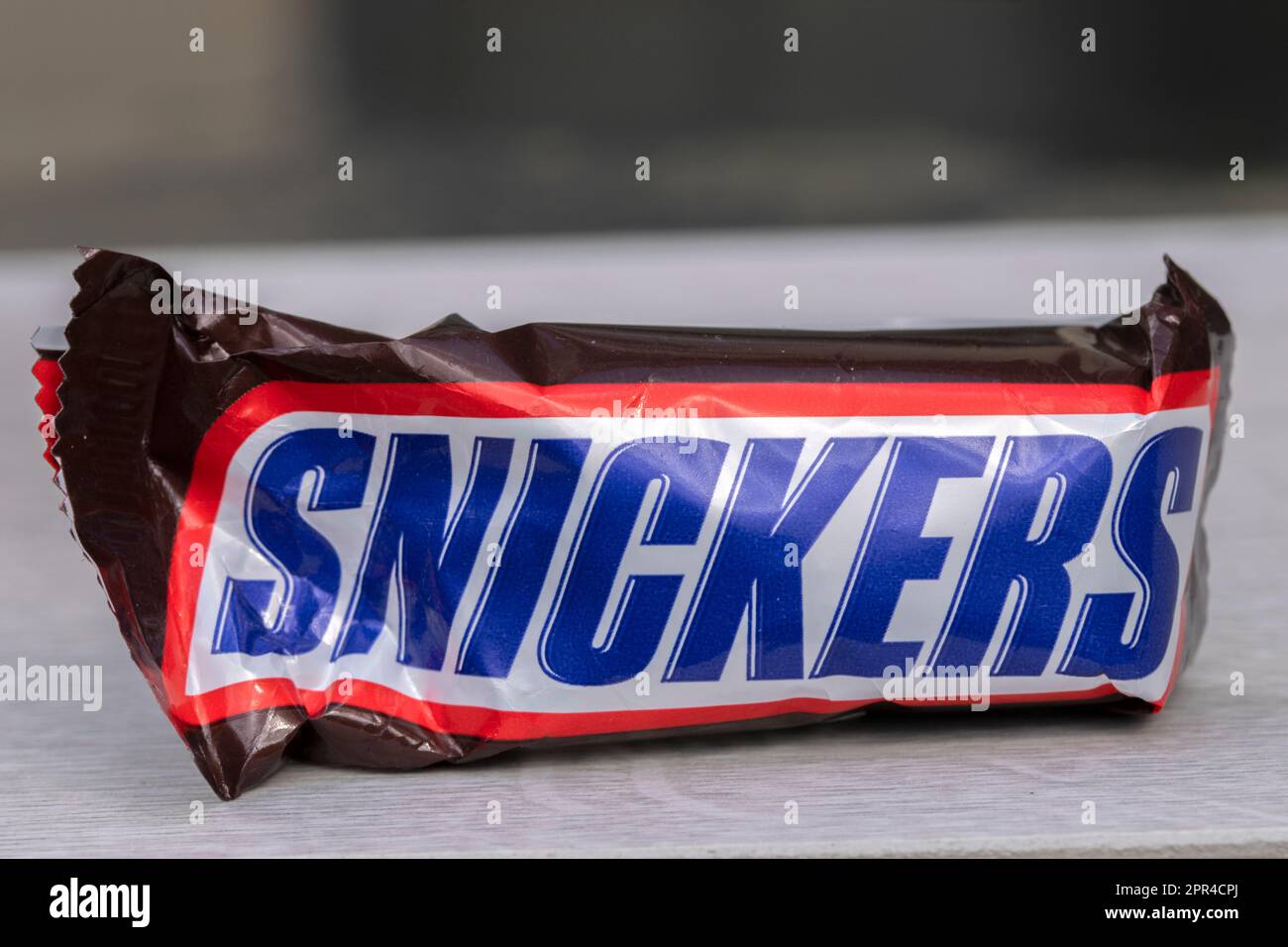A single Fun Size Snickers candy bar isolated on white Stock Photo - Alamy