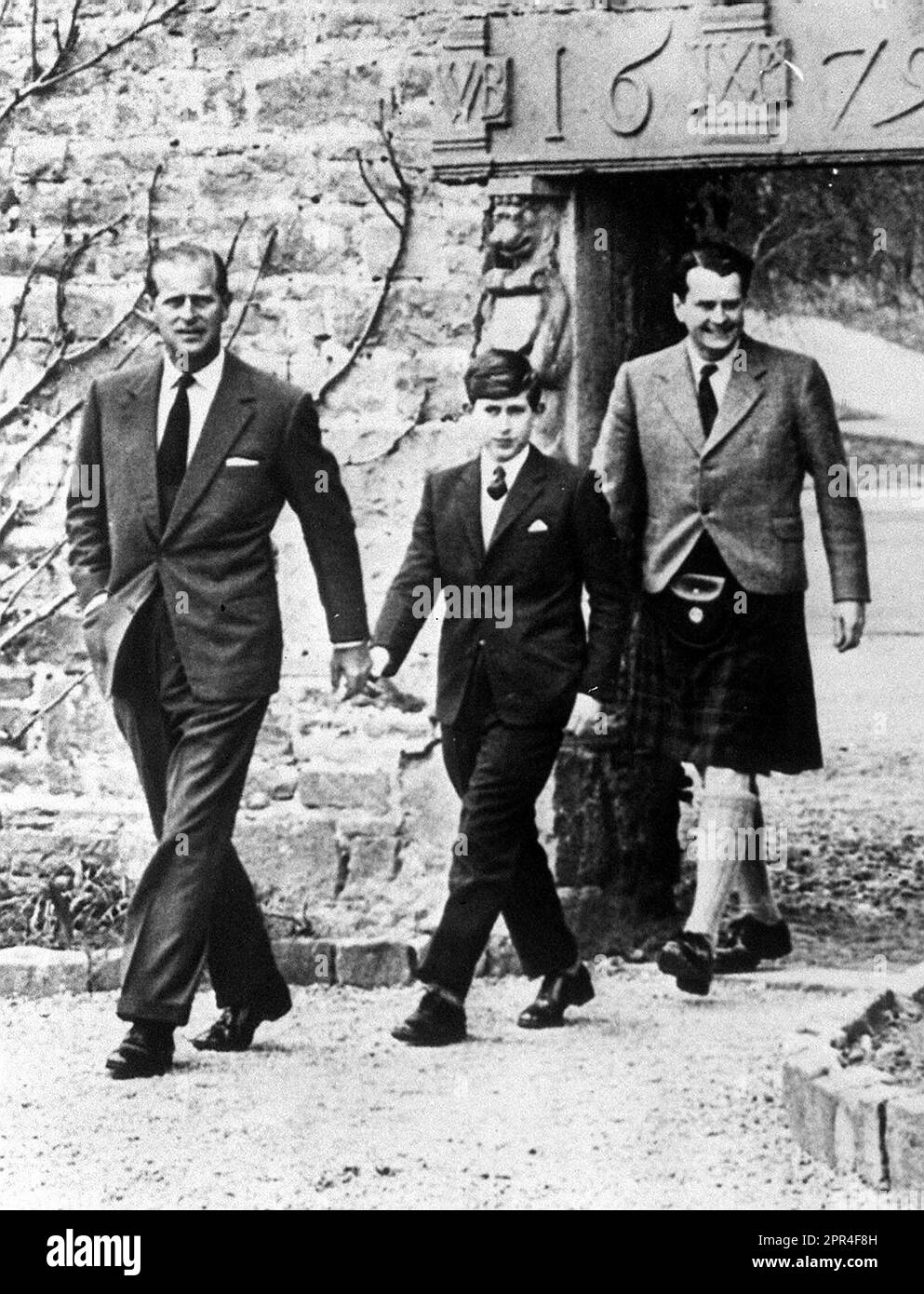 File photo dated 01/05/62 of Prince Charles with his father the Duke of Edinburgh (left) and Captain Iain Tennant, Chairman of the Gordonstoun Board of Governors, arriving at Gordonstoun for the Prince's first day at the public school. Issue date: Wednesday April 26, 2023. Stock Photo