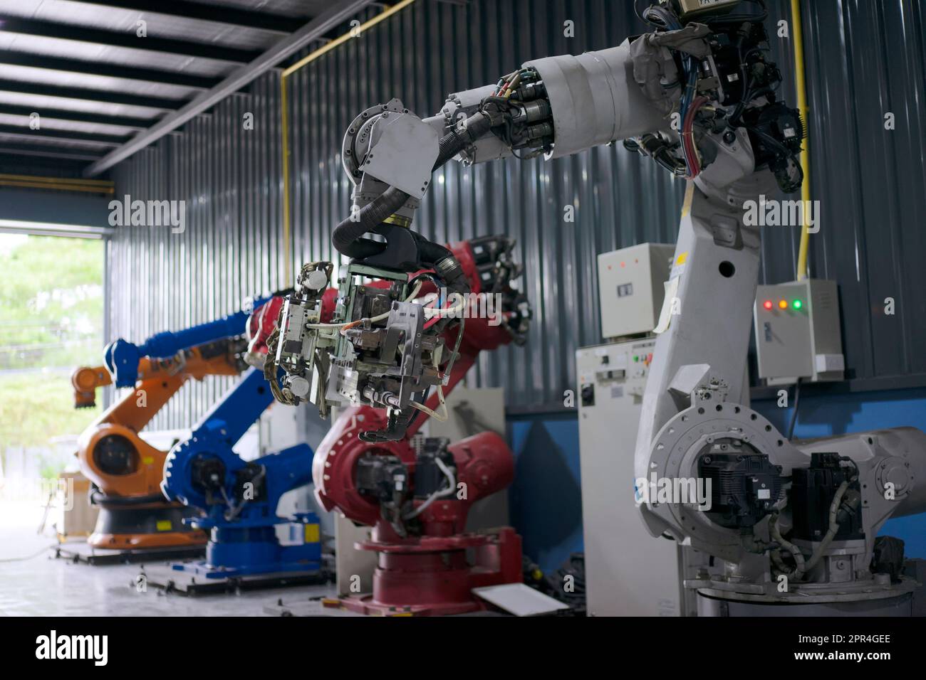 Engineer work at robotic arm factory. Technology and engineering concept. Stock Photo