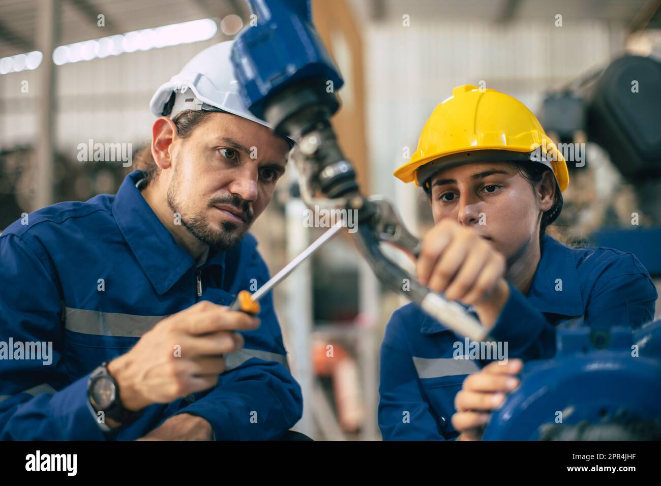 Engineer technician team service checking heavy industry machine robot