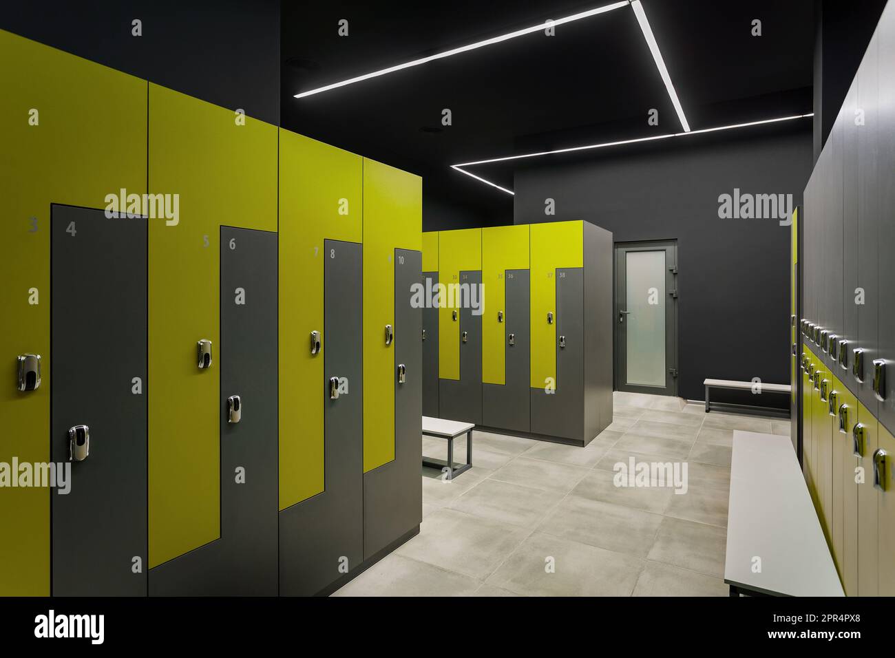 Sport wardrobe, locker room in sport club. Yellow and grey. Dressing room Stock Photo