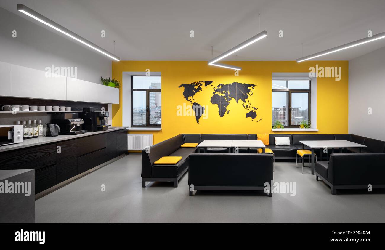 Interior photography of breakout area in office. Yellow kitchen in the office. Stock Photo