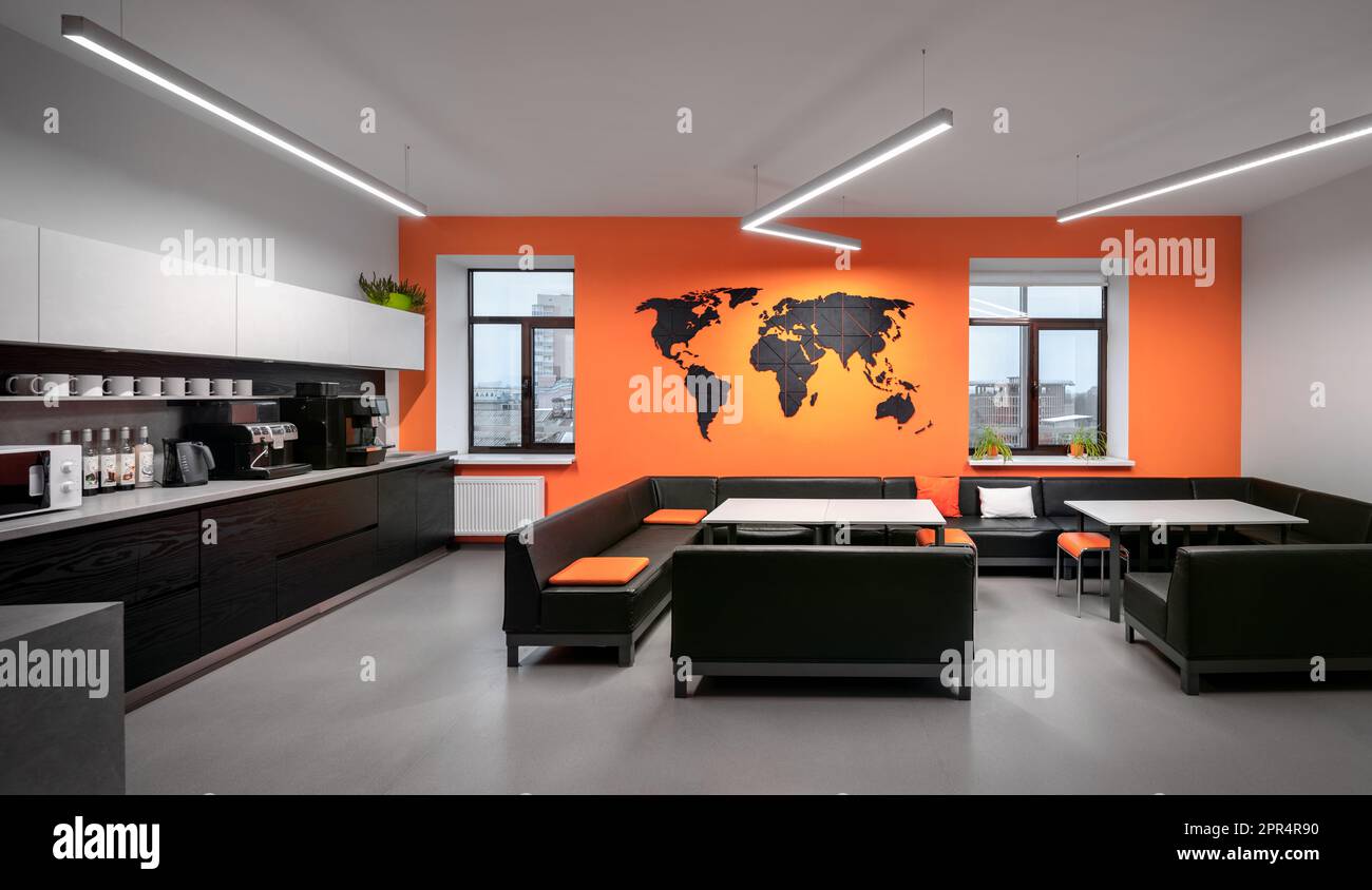 Interior photography of breakout area in office. Orange kitchen in the office. Stock Photo
