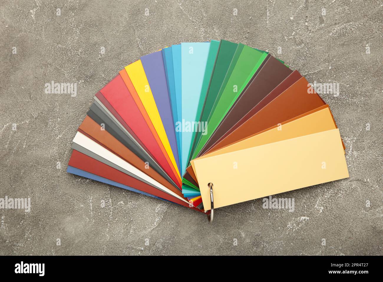 Colored cardboard palette, paper catalog on a grey concrete background