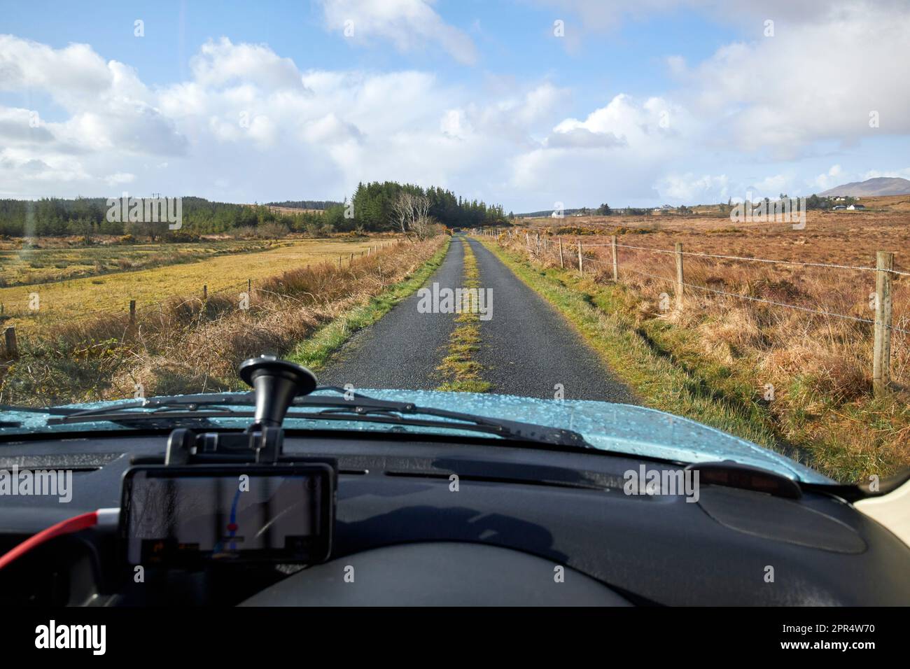 using sat nav to navigate long single track road through the mountain bogs and mountains outside county donegal republic of ireland Stock Photo