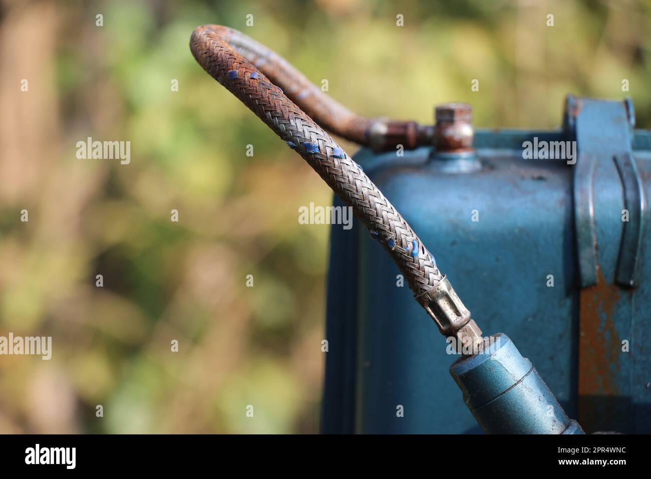 Diesel fuel injector connecting the fuel tank and fuel inlet valve via a fuel pipe Stock Photo