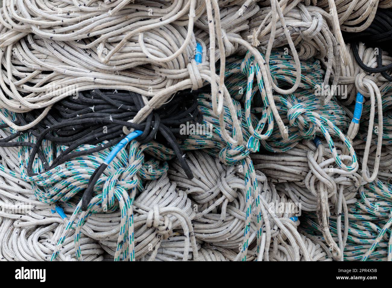 Retro fishing nets in bags, closeup. A pile of old fishing net Stock
