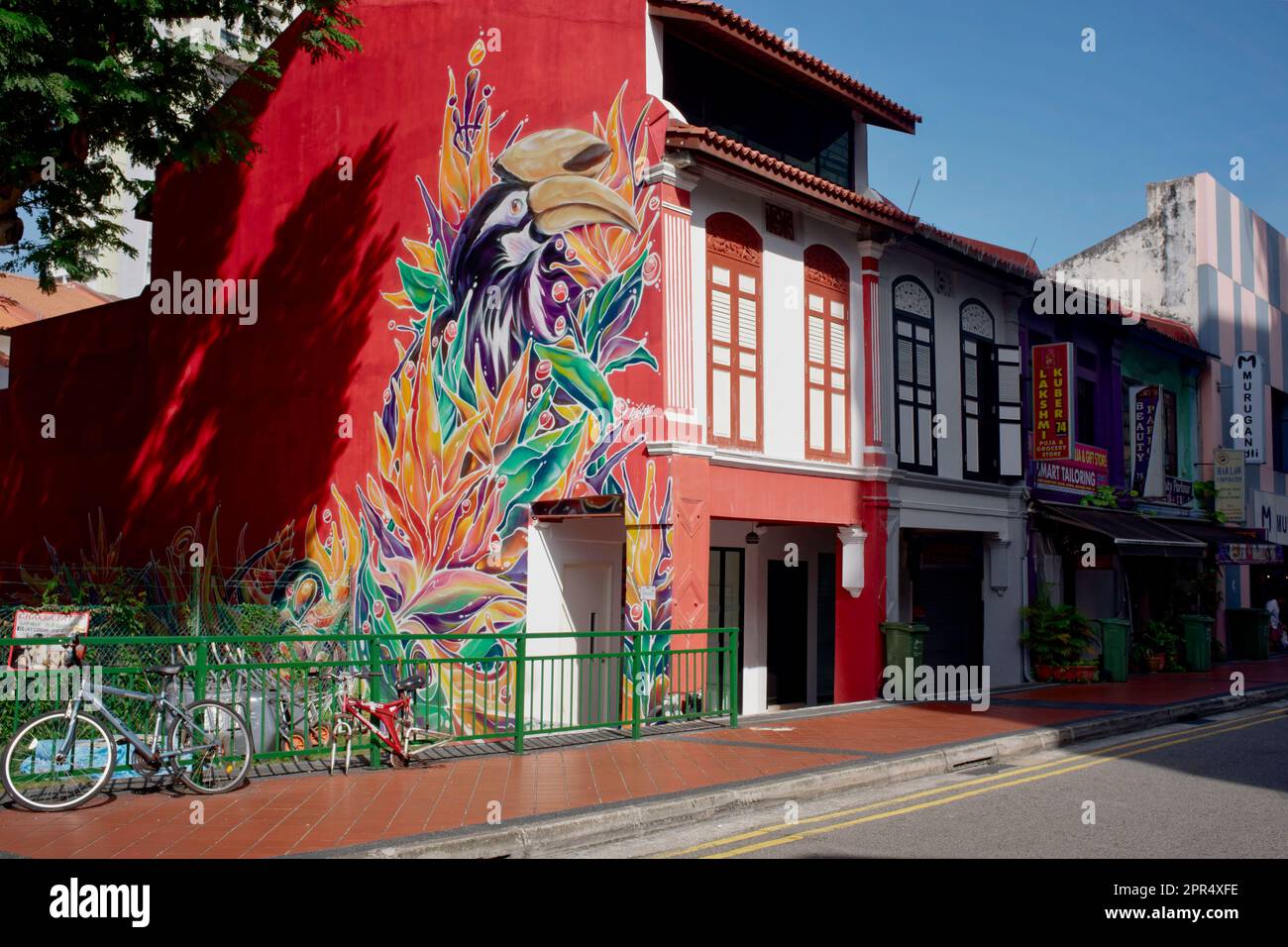 A colorfully painted traditional Chinese shophouse with latticed windows in Syed Alwi Road, Little India, Singapore Stock Photo