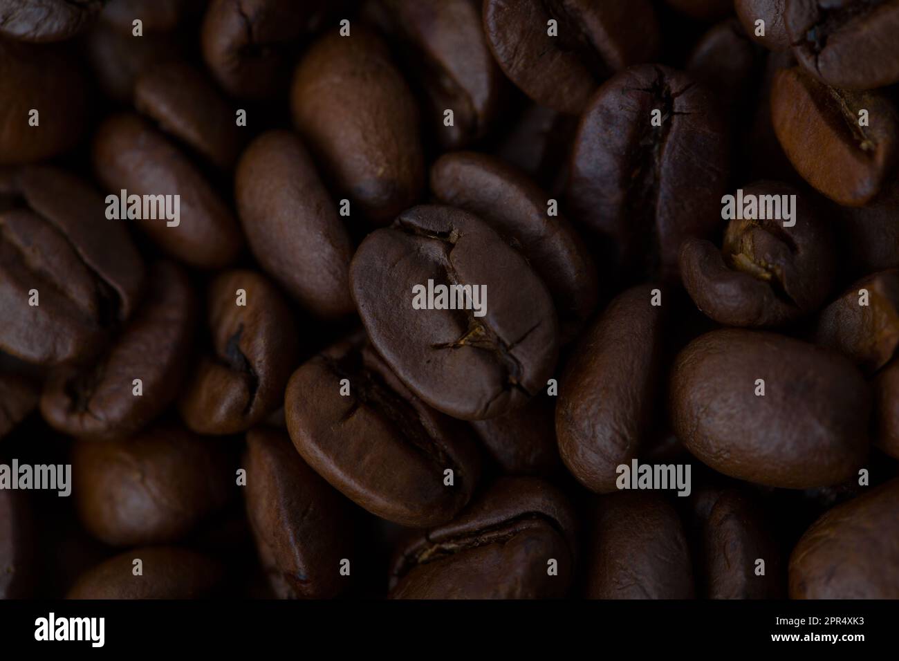 Roasted coffee beans background abstract top view Stock Photo - Alamy