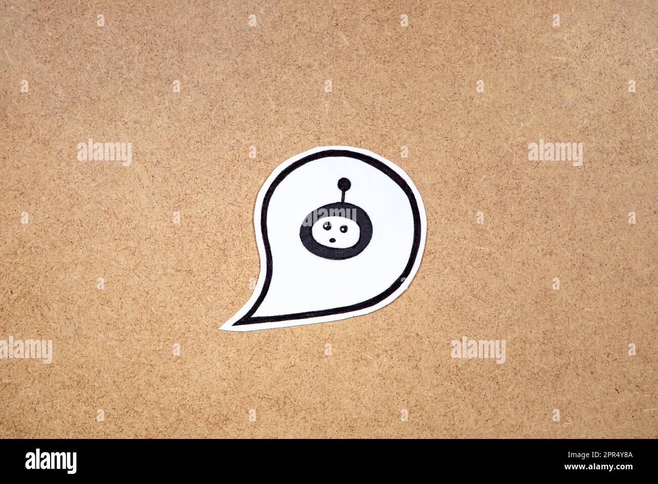 Bot in the speech bubble, concept of chatting with bot. Asking question to AI. Bot representation ready to work. Stock Photo