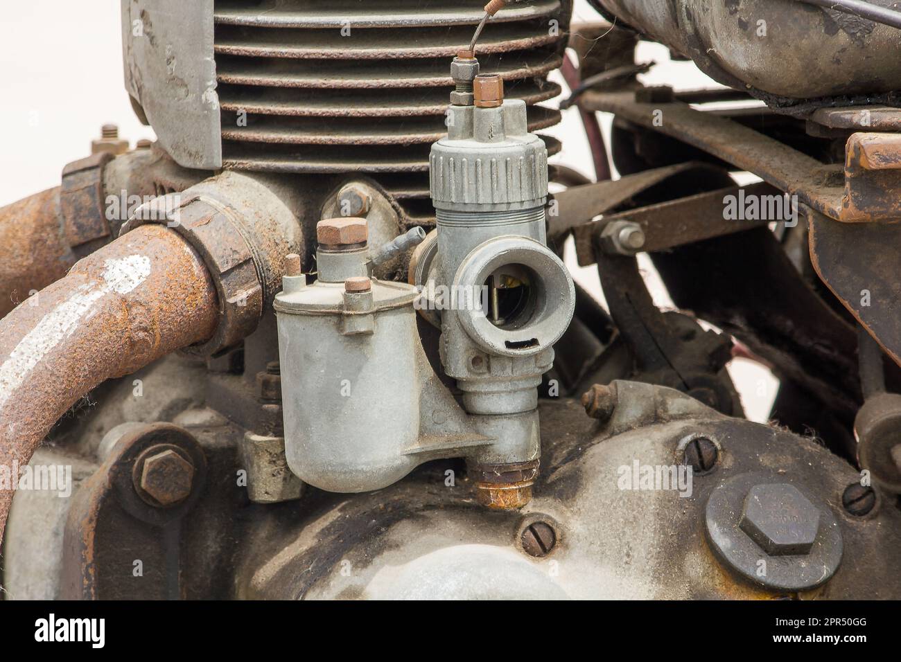 Old carburettor in the engine of an antique car for many years Stock