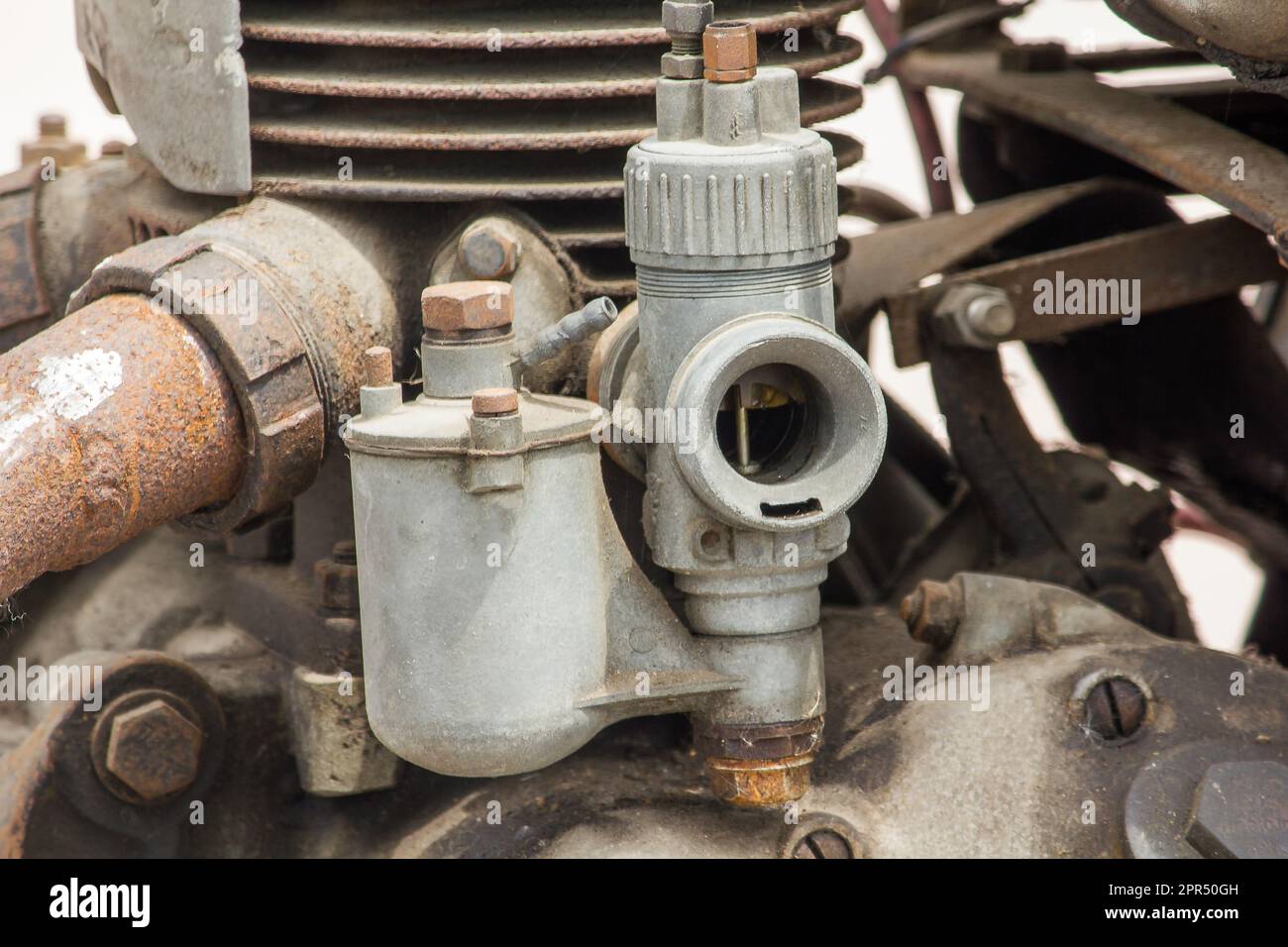 Old carburettor in the engine of an antique car for many years Stock