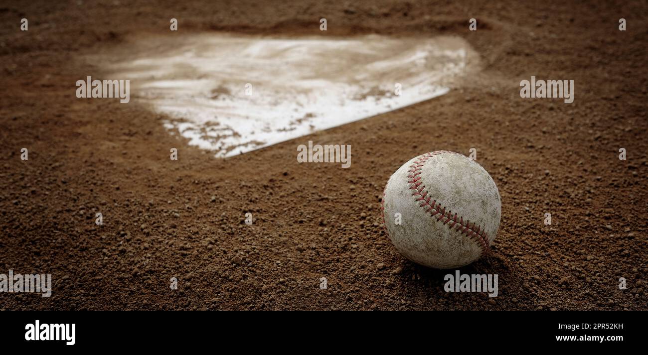 Old leather baseball on dirt field by home plate or a base Stock Photo ...