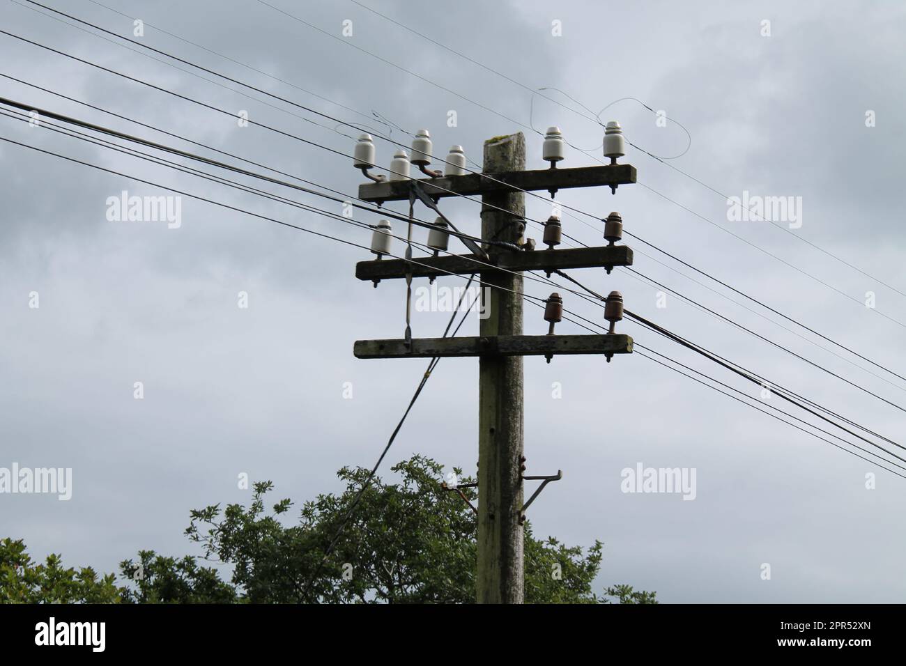 A Wooden Telegraph Pole to Hold Telephone Wires. Stock Photo