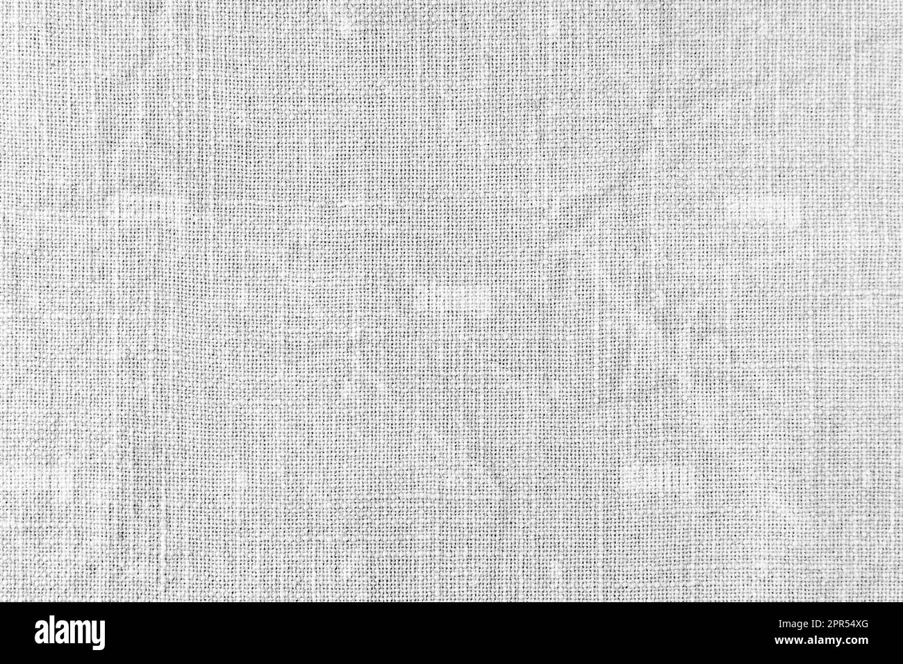 Natural white linen fabric texture background. Flax cloth surface, tablecloth, upholstery, curtains textile. Top view, close up Stock Photo