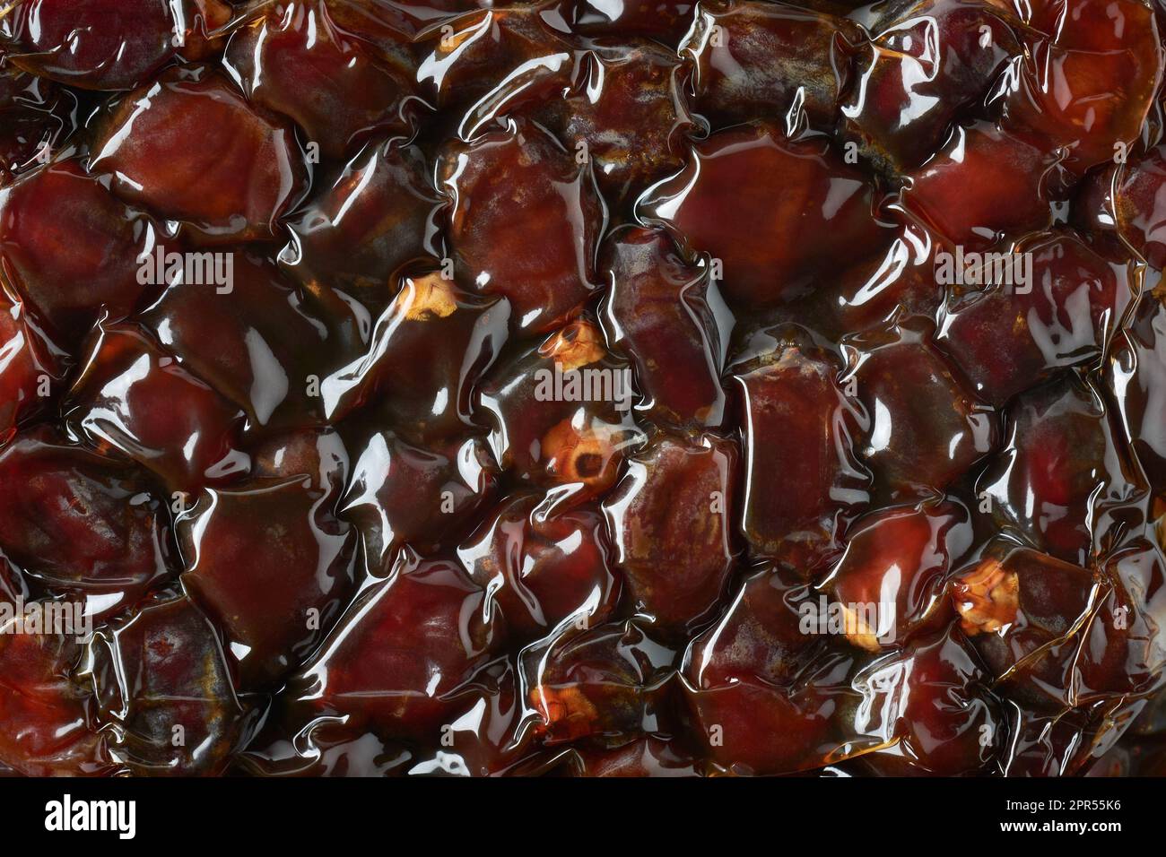 closeup of dates in vacuum sealed packs, edible and tropical sweet fruits in thermoforming