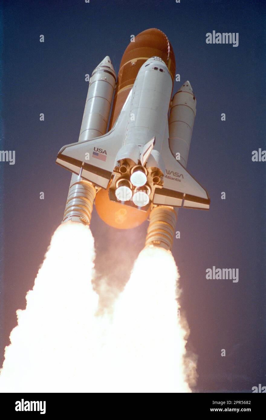 Liftoff of first flight of Atlantis and the STS 51-J mission. The view is from the below the orbiter and show its solid rocket boosters firing. Stock Photo