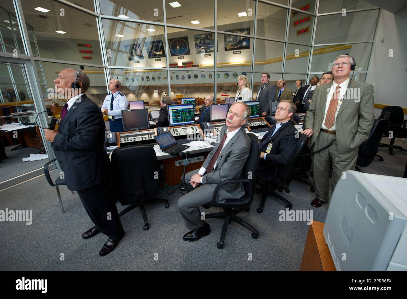 NASA Administrator Charles Bolden, left, and other NASA managers monitor the launch of space shuttle Endeavour (STS-134) in Firing Room 4, Monday, May 16, 2011, at Kennedy Space Center in Cape Canaveral, Fla. During the 16-day mission, Endeavour, with Commander Mark Kelly, Pilot Gregory H. Johnson, Mission Specialists Michael Fincke, Greg Chamitoff, Andrew Feustel and European Space Agency astronaut Robert Vittori will deliver the Alpha Magnetic Spectrometer (AMS) and spare parts including two S-band communications antennas, a high-pressure gas tank and additional spare parts for Dextre. Photo Stock Photo