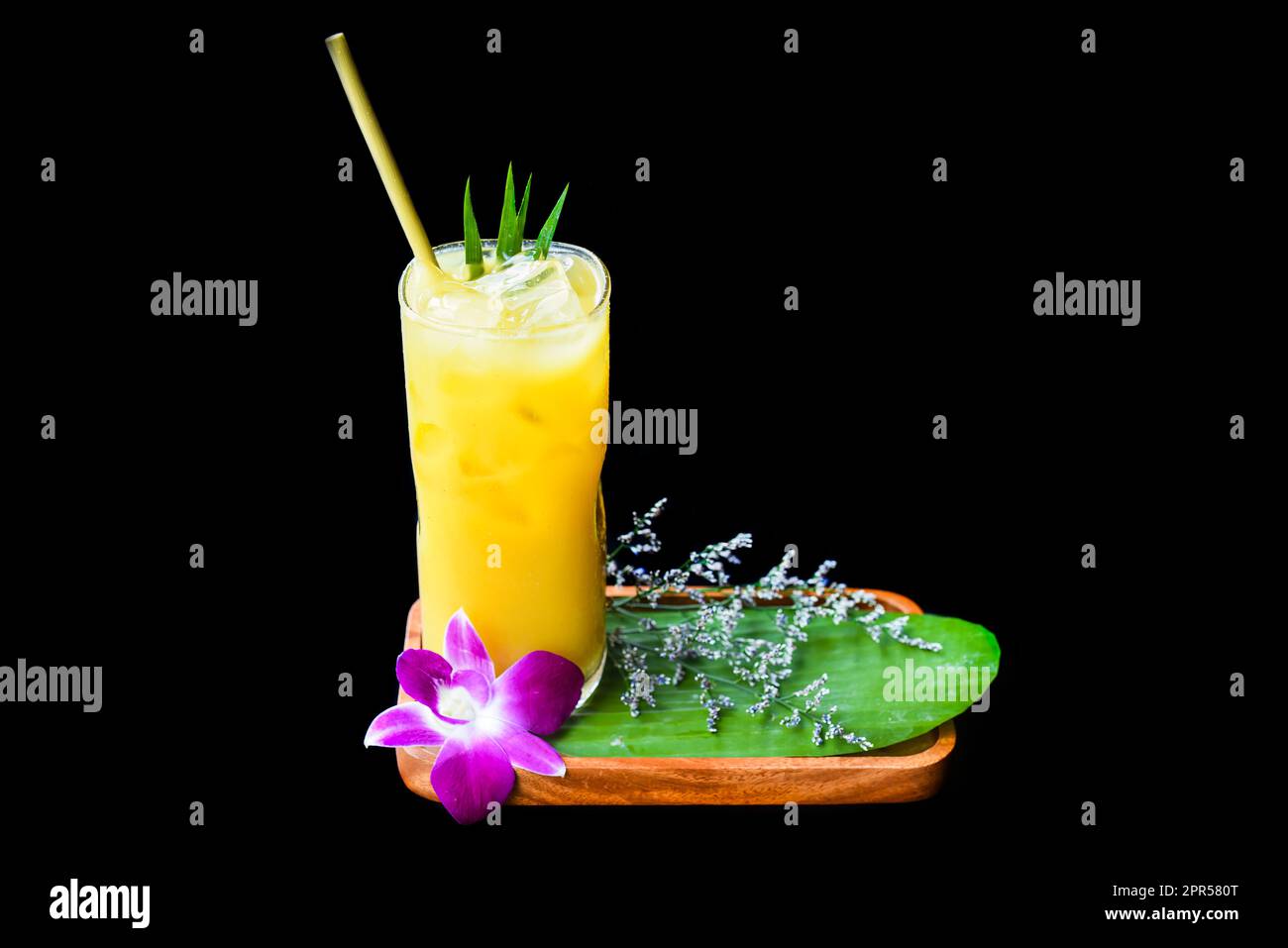 Passion fruit juice with with flowers isolated on black background Stock Photo
