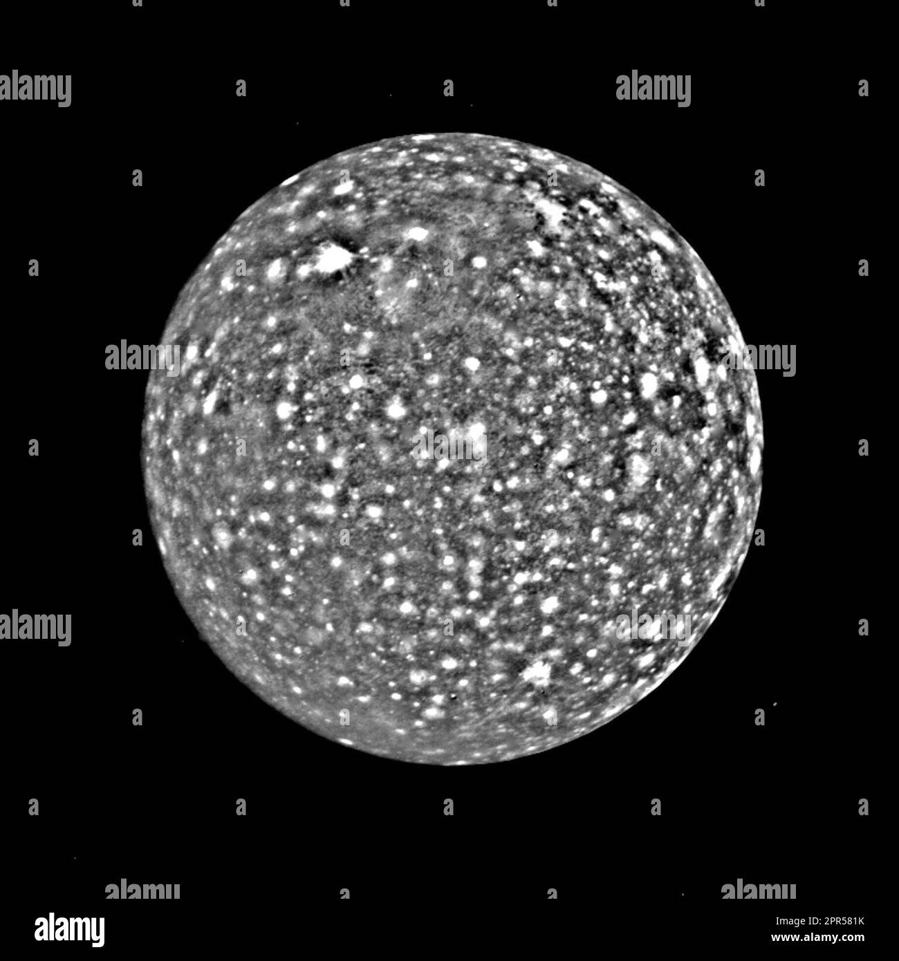 Voyager 1 took this picture of Callisto during Voyager's approach to Jupiter's outer large satellite in 1979. Both Galileo and Marius discovered Callisto in 1610. In Greek mythology, Callisto was a nymph loved by Zeus and thus hated by Hera. Hera turned her into a bear, which Zeus placed in the heavens as the constellation Ursa Major. Voyager was 350,000 kilometers from Callisto and took this picture that shows features about seven kilometers wide across the surface. Callisto is a little smaller than Ganymede (Callisto is about the size of Mercury) and it seems that it is composed of a mixture Stock Photo