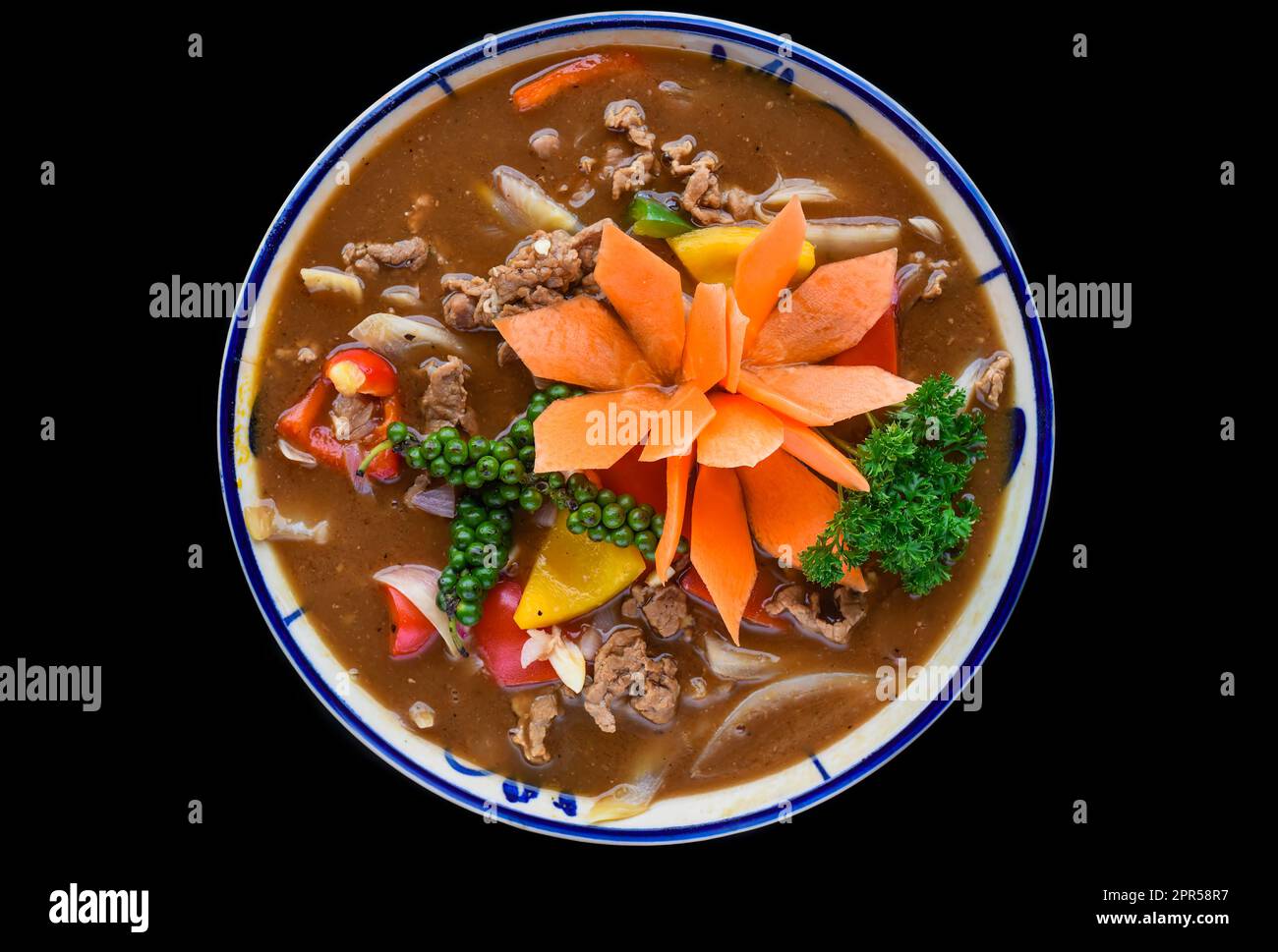 Vietnamese beef with pepper sauce and bread isolated on black background Stock Photo