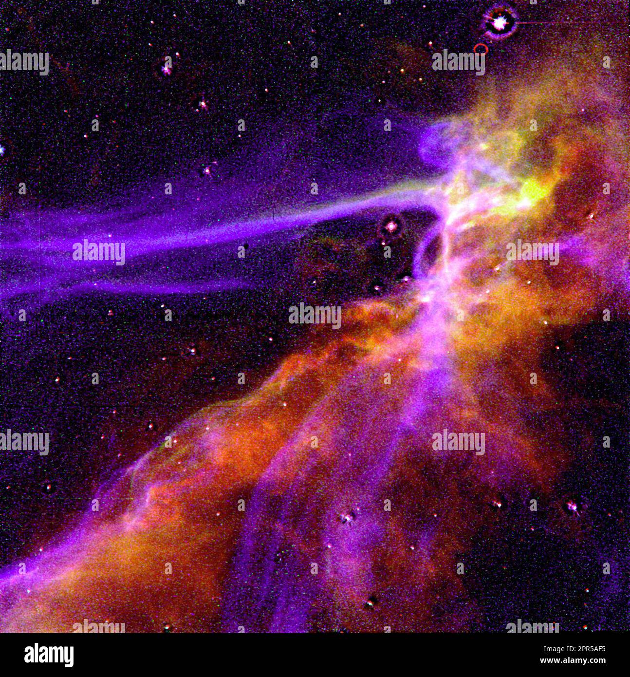 This is an image of a small portion of the Cygnus Loop supernova remnant, which marks the edge of a bubble-like, expanding blast wave from a colossal stellar explosion, occurring about 15,000 years ago. The HST image shows the structure behind the shock waves, allowing astronomers for the first time to directly compare the actual structure of the shock with theoretical model calculations. Besides supernova remnants, these shock models are important in understanding a wide range of astrophysical phenomena, from winds in newly-formed stars to cataclysmic stellar outbursts. The supernova blast is Stock Photo
