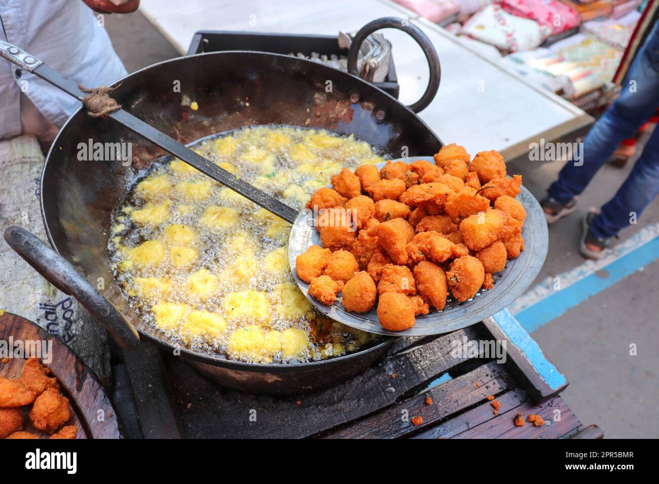 Indian Street Food Roadside Pakoda Preparation. Crispy Oil Fry Pakora Making. Stock Photo