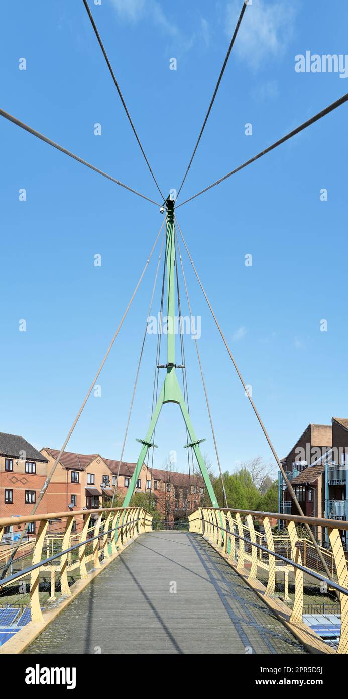 Wathen Wigg suspension bridge over the river Nene at Northampton, named after the founder of the professional rugby club in the town. Stock Photo