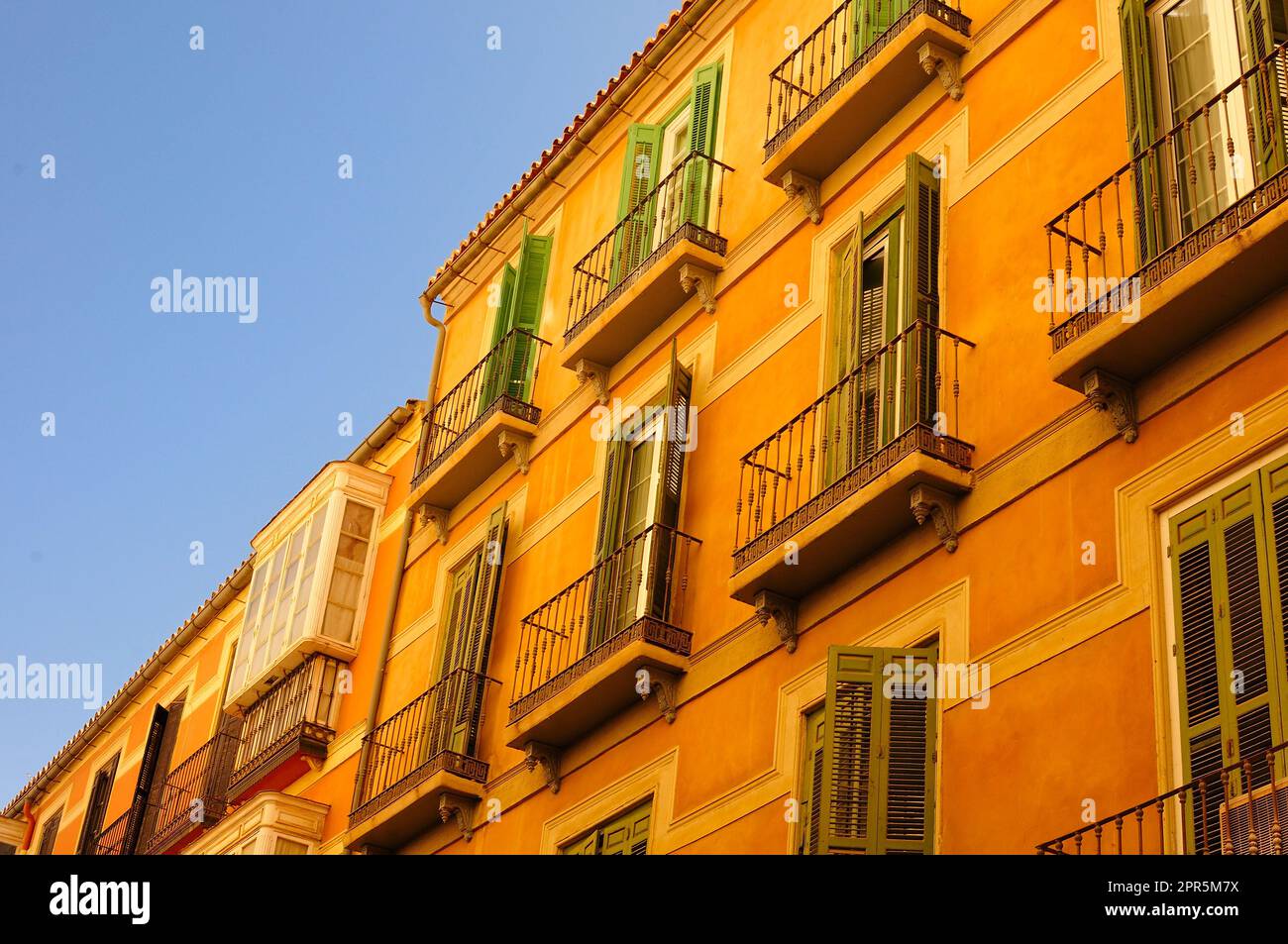 A row of traditional Spanish apartment houses in the centre of Malaga
