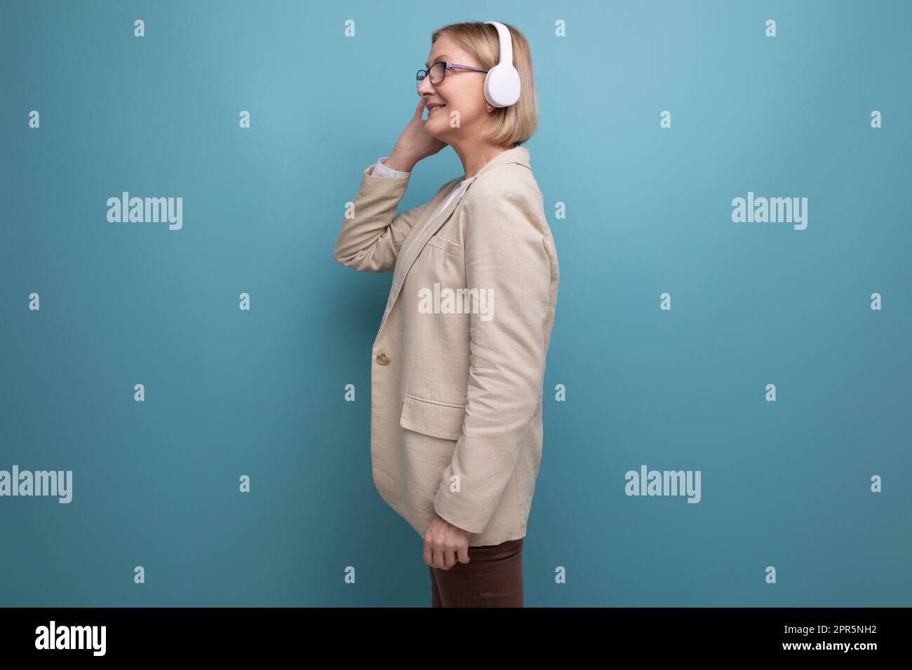 50s a woman in a jacket masters the technique for listening to music in