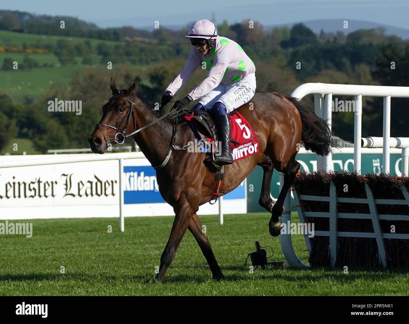 Gaelic Warrior ridden by Paul Townend on the way to winning the Irish Mirror Novice Hurdle during day two of the Punchestown Festival at Punchestown Racecourse in County Kildare, Ireland. Picture date: Wednesday April 26, 2023. Stock Photo