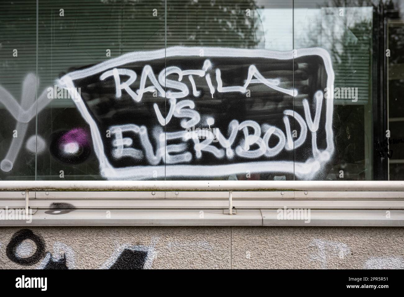 Rastila vs. Everybody. Graffiti on balcony glass at Pallaksentie 1 in suburban Mellunmäki district of Helsinki, Finland. Stock Photo