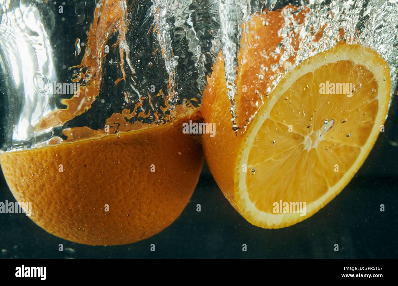 Oranges falling in clear water Stock Photo Alamy