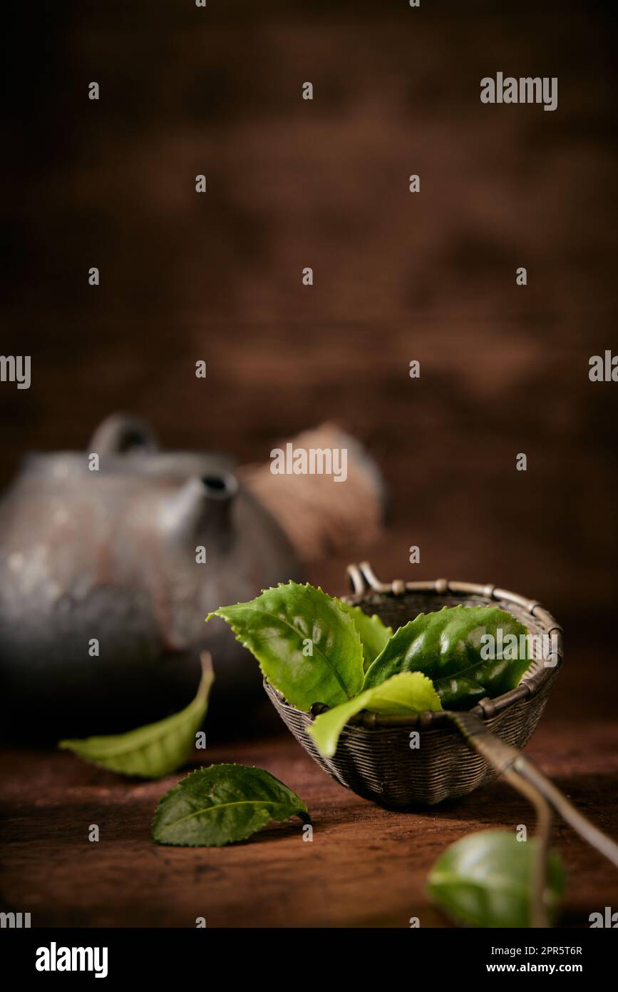 Tea leaves near vintage teapot Stock Photo Alamy
