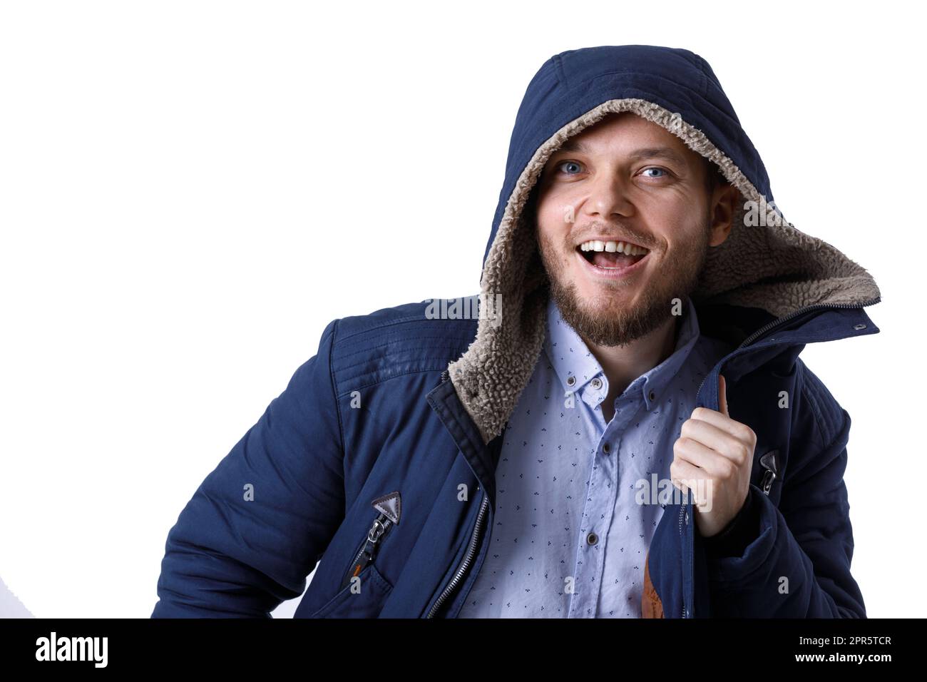 Smiling young man in winter warm coat. Stock Photo