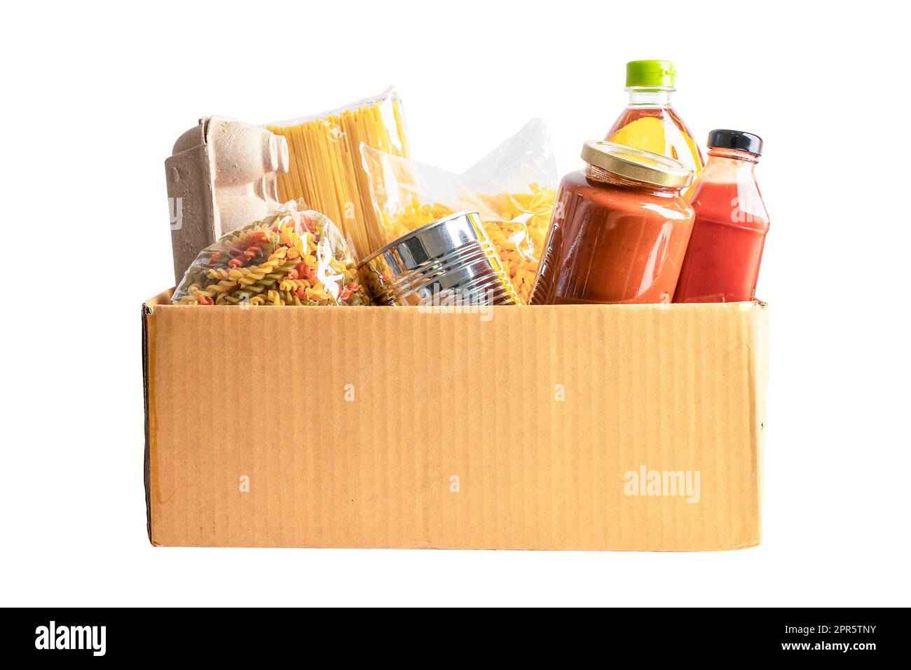 Foodstuff for donation, storage and delivery. Various food, pasta, cooking oil and canned food in cardboard box. Stock Photo