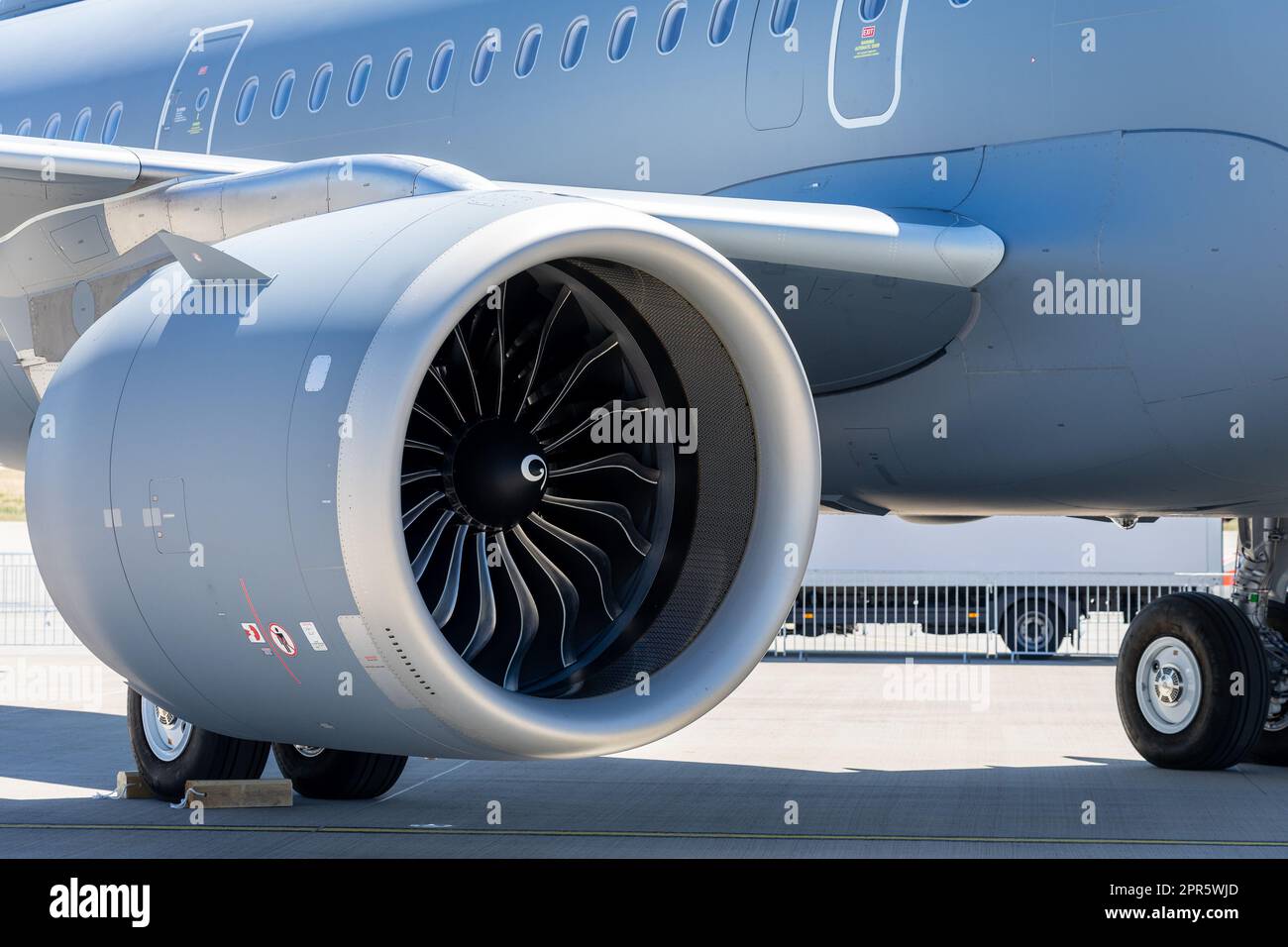Jet engine, part of the wing and fuselage of a passenger aircraft. Stock Photo