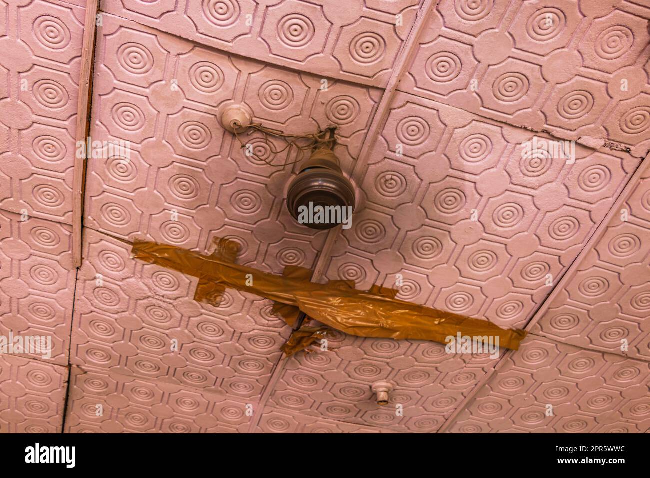 Broken ceiling and fan at roof Agra India. Stock Photo
