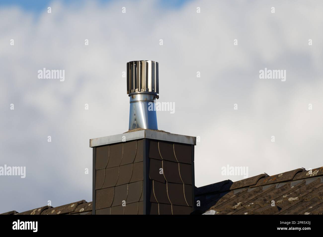 Stainless Steel Rotating Chimney Cowl on a chimney clad with slate