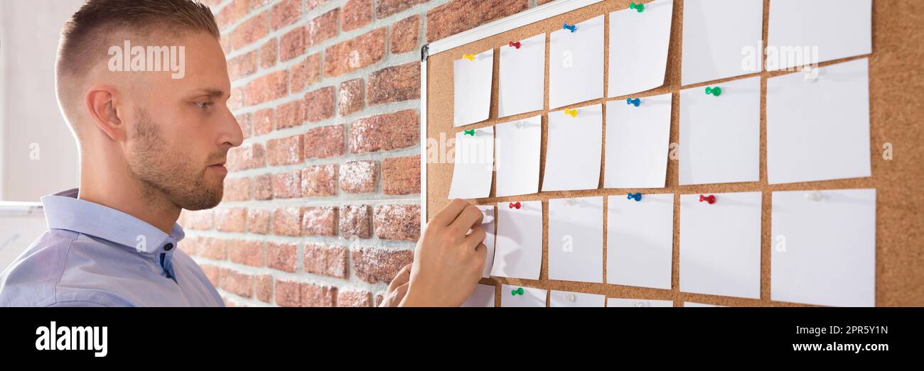 Looking at bulletin hi-res stock photography and images - Alamy