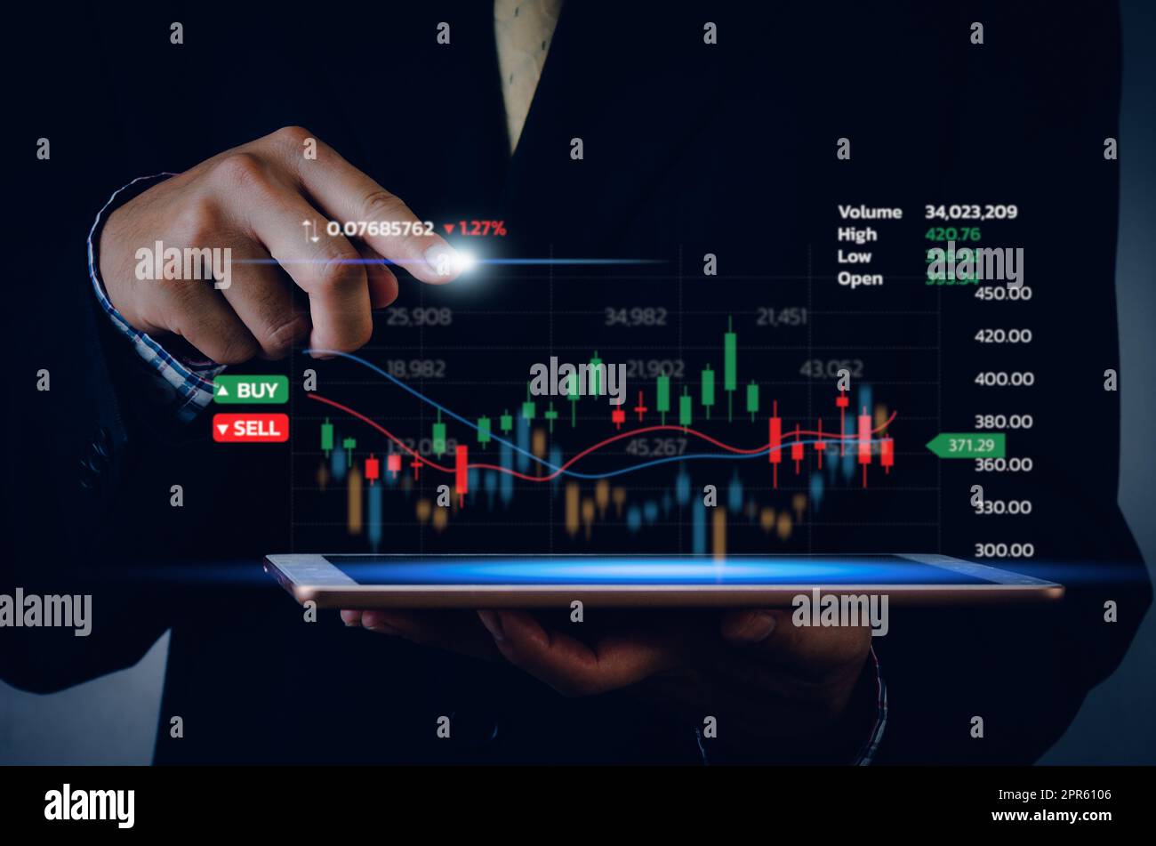 Stock market chart business using a tablet to analyze online trading data.Forex graph financial and investment on a virtual screen concept. Stock Photo