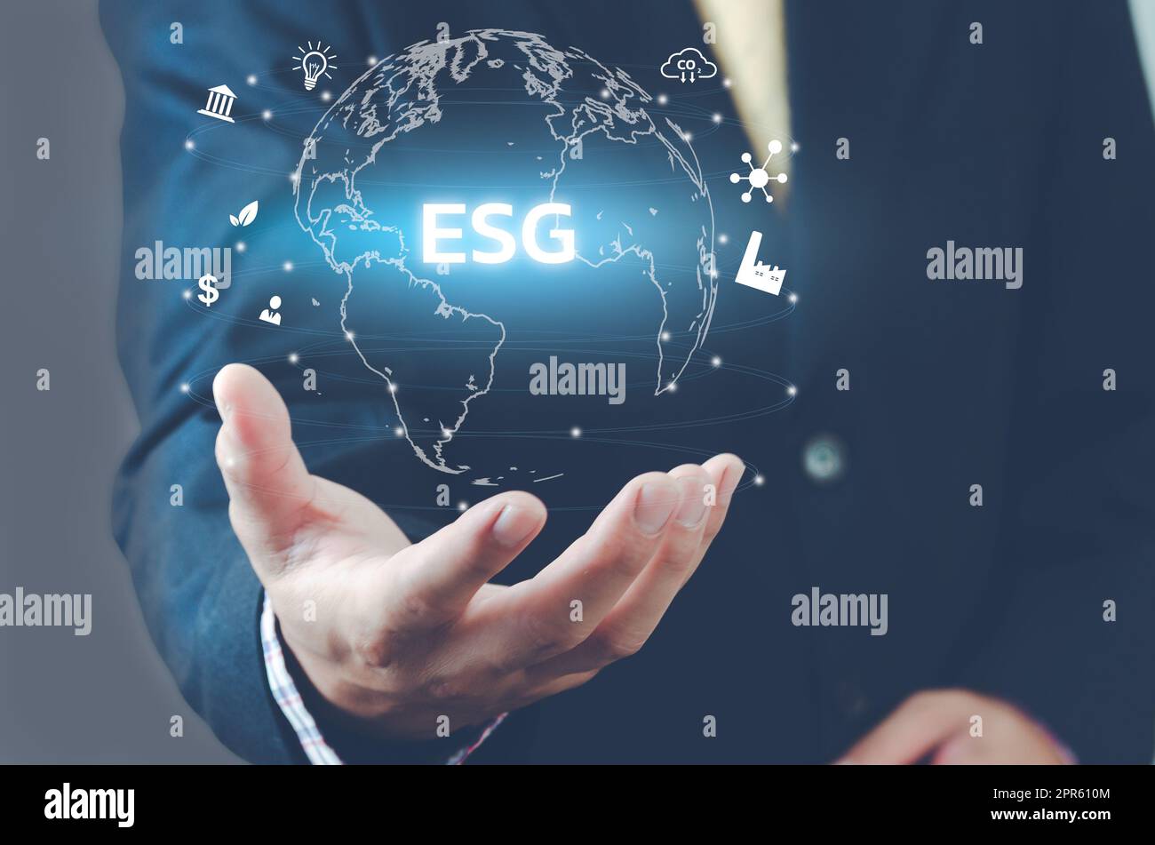 Man hand virtual world icon. ESG Environmental Social Governance icons and symbols virtual screen. Business concept. Stock Photo