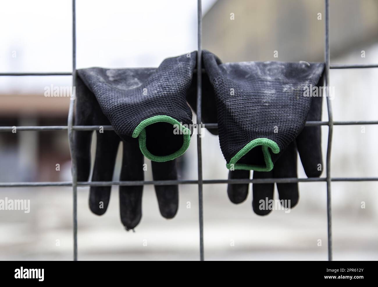 Gloves hanging on a fence Stock Photo Alamy