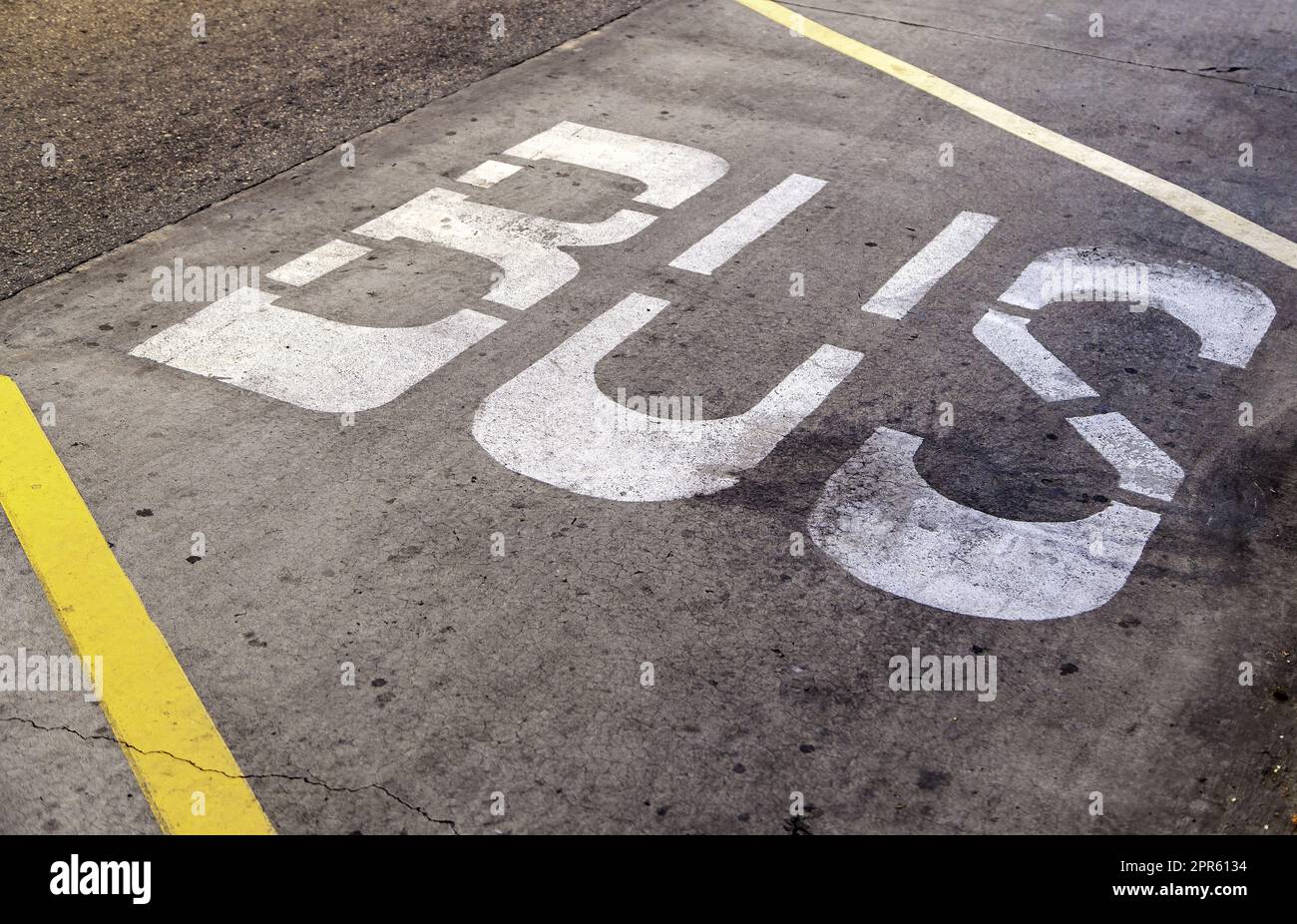 Bus sign on the asphalt Stock Photo