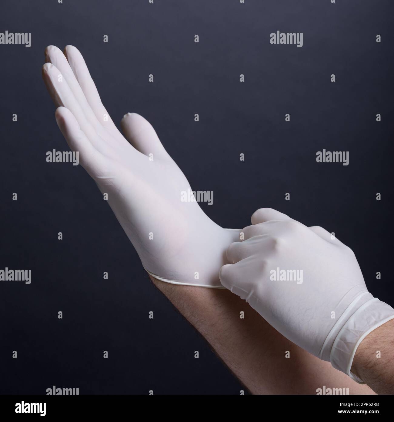 Male hands in latex gloves Stock Photo