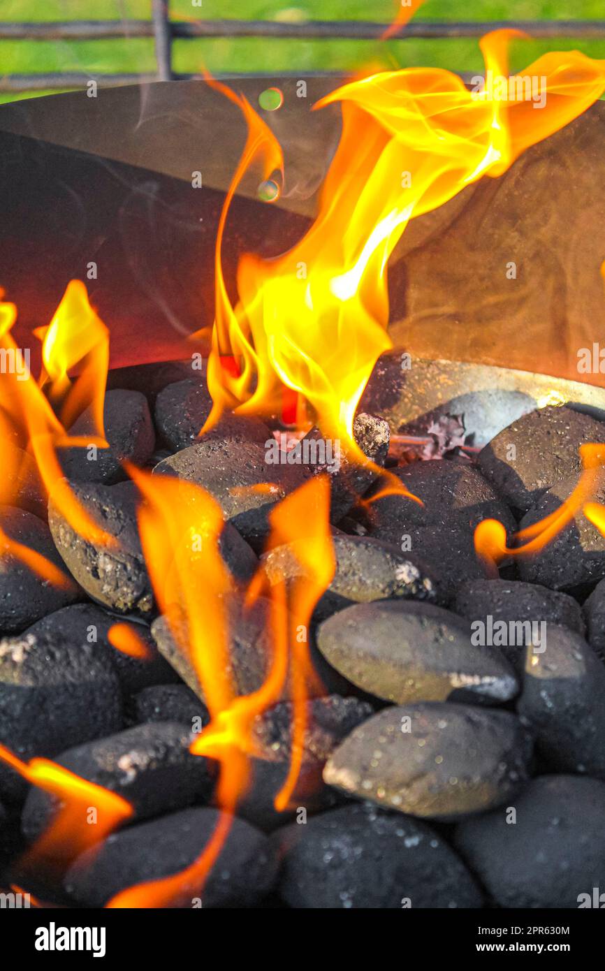 Preparing Barbeque BBQ Campfire and burning wood with orange flames Stock Photo Alamy