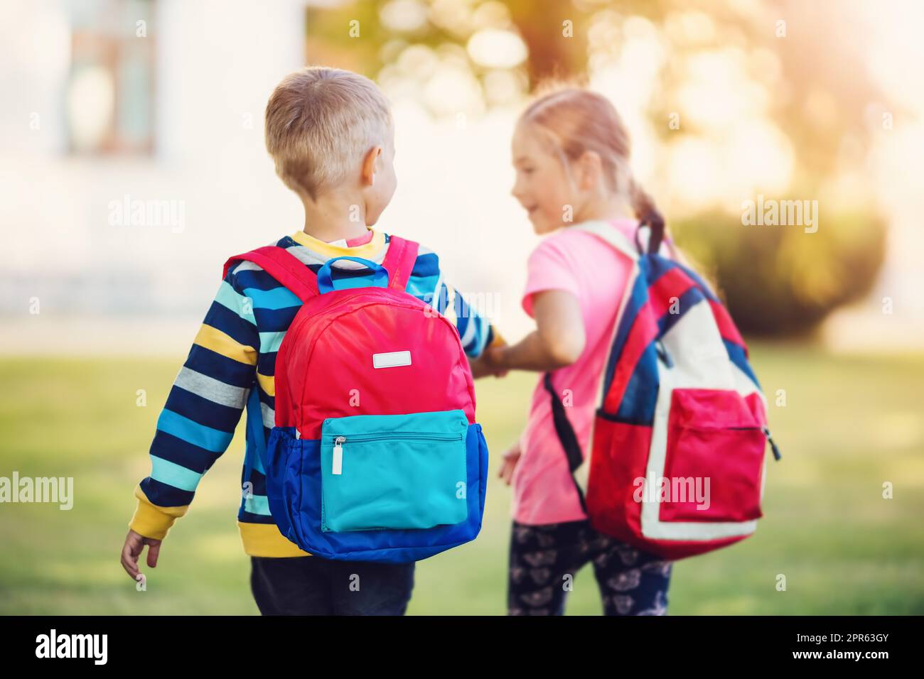 Boy and girl holding hands hi-res stock photography and images - Alamy