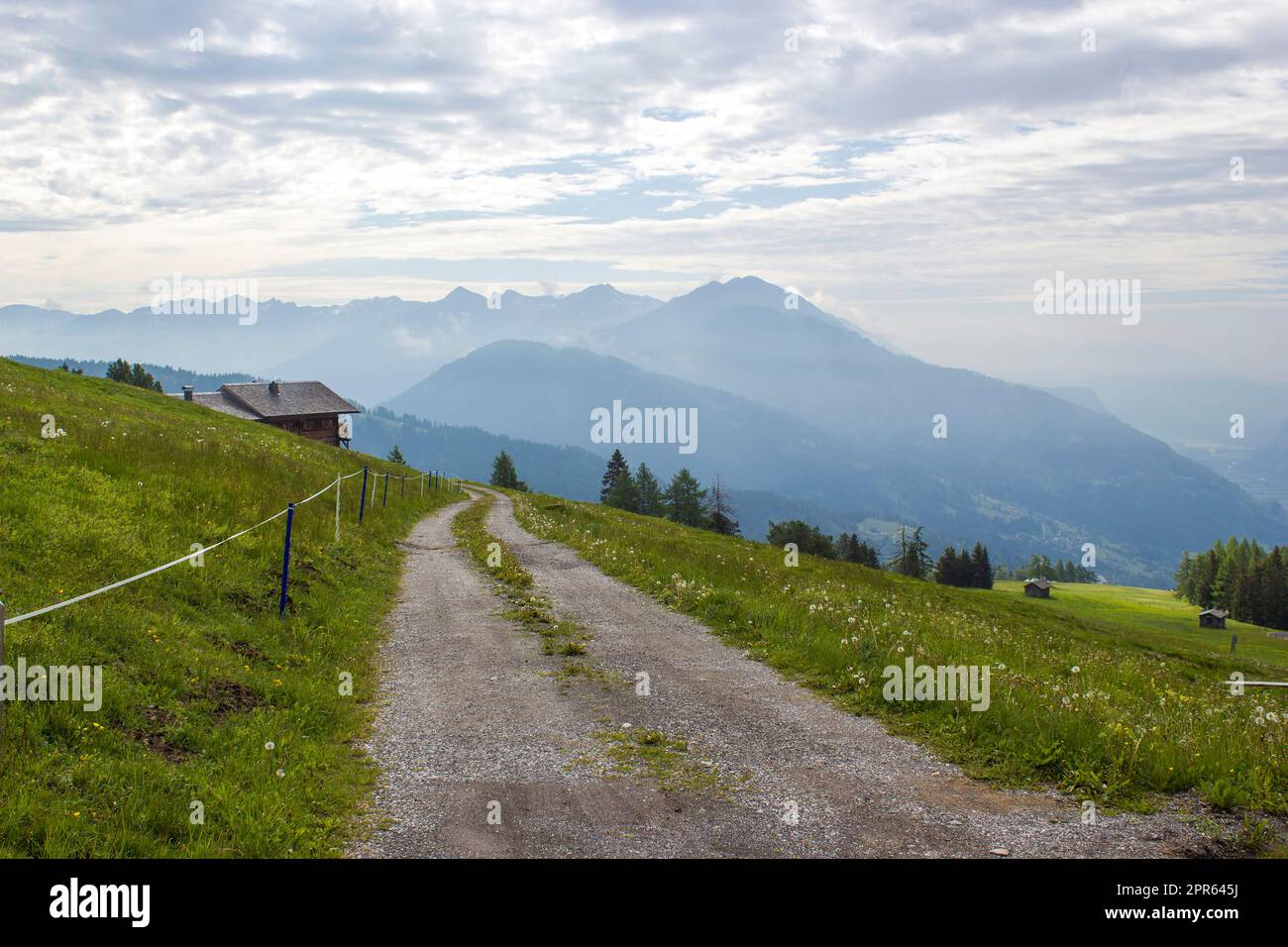 Landscape of Lienz Dolomites in Austria. Road and panorama of massive Alpine mountains. Stock Photo